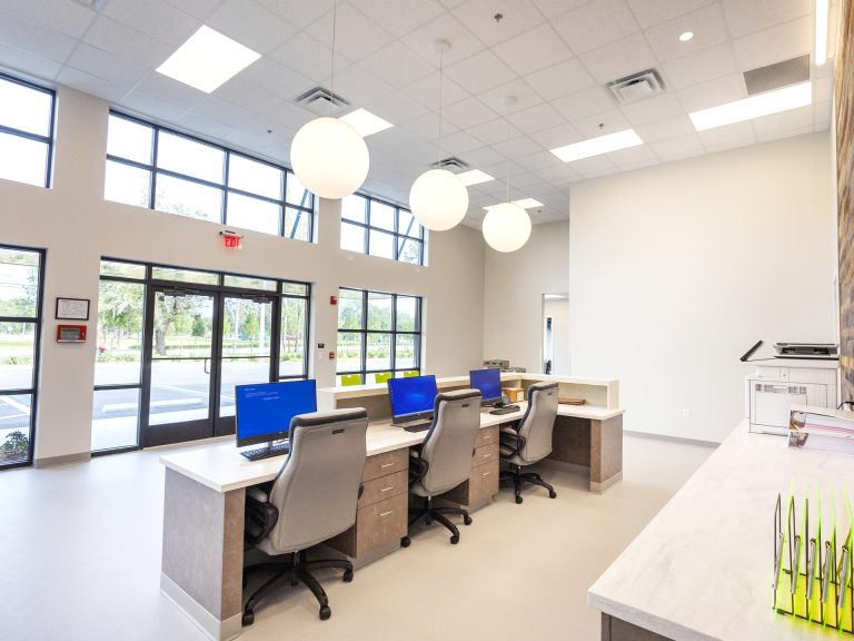 Oviedo Veterinary Care & Emergency Clinic - Modern reception area with three workstations