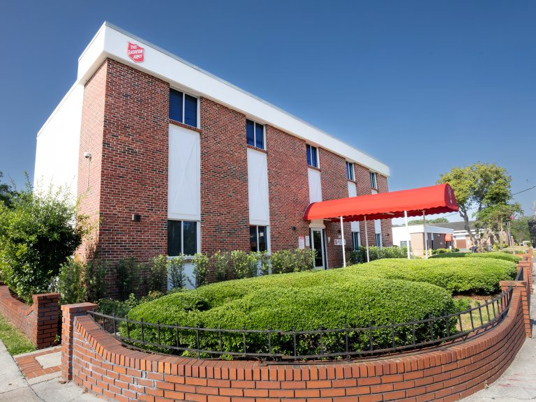 Salvation Army Women & Children's Center - Three-story brick red building with white trim